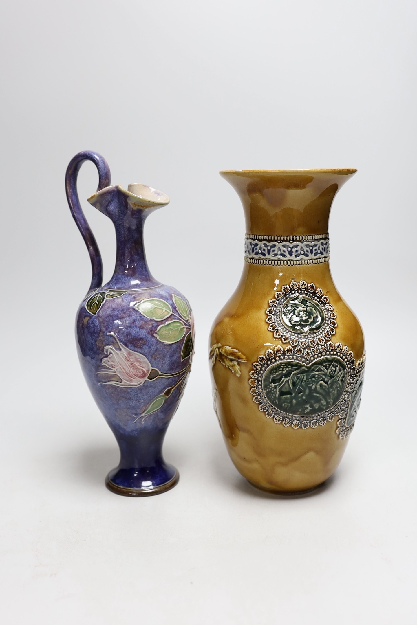 A Doulton stoneware vase and jug, tallest 28cm, together with three art ceramic bowls